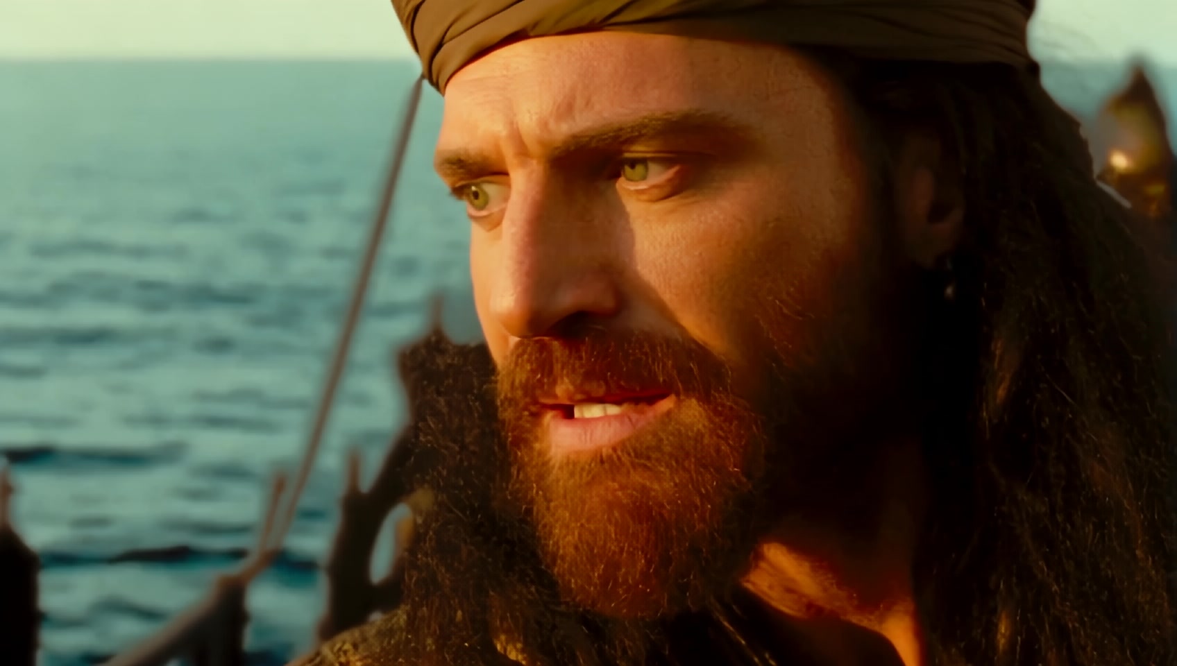 A North African man, rugged face with a strong jawline, piercing green eyes, long dark hair tied in a ponytail, muscular build reflecting his life at sea. 16th century, Muslim pirate with piercing eyes, turban on head and red beard, talking to Moroccan princess