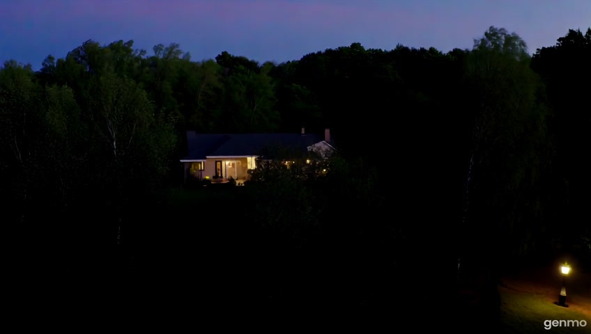 An aerial shot of a Evening shot of a house.