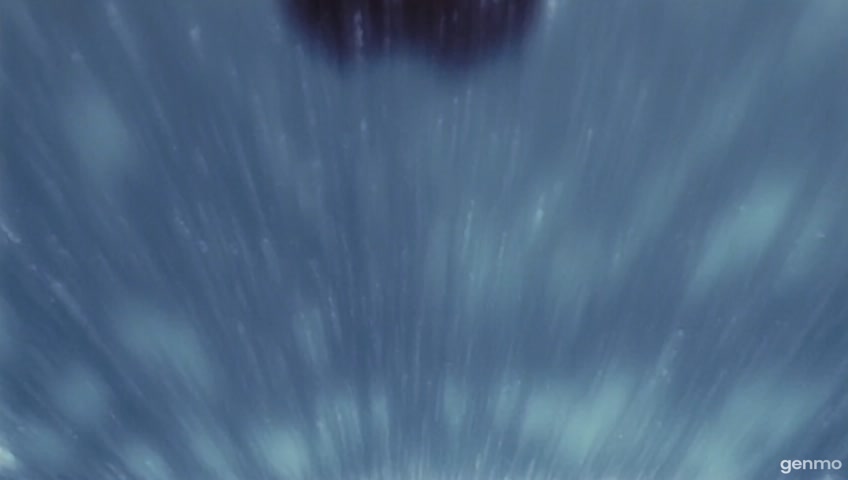 Continuous shot. The camera zooms out. The room fills up with water rapidly, flooding from bottom to top. The water reaches the woman's neck. The woman sheds her clothing and paddles to stay afloat