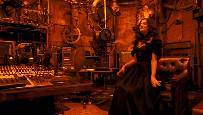 imagine a steampunk recording studio with mixer, musical instruments and a actress stana katic lookalike dressed up in a black steampunk dress sitting in the edge and laughing out loud while holding up her hand