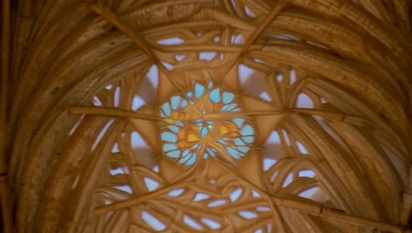 A colorful kaleidoscope with the image of Christ in a church