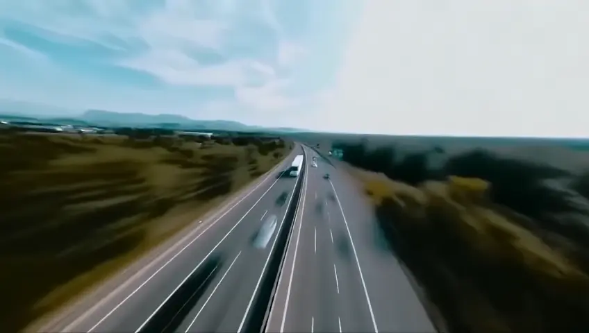 FLY THROUGH FPV SHOT, moving at super speed faster, over the highway on which cars are driving at high speed, along the sides of the highway flashing trees, flying birds, beautiful scenery, scenic video