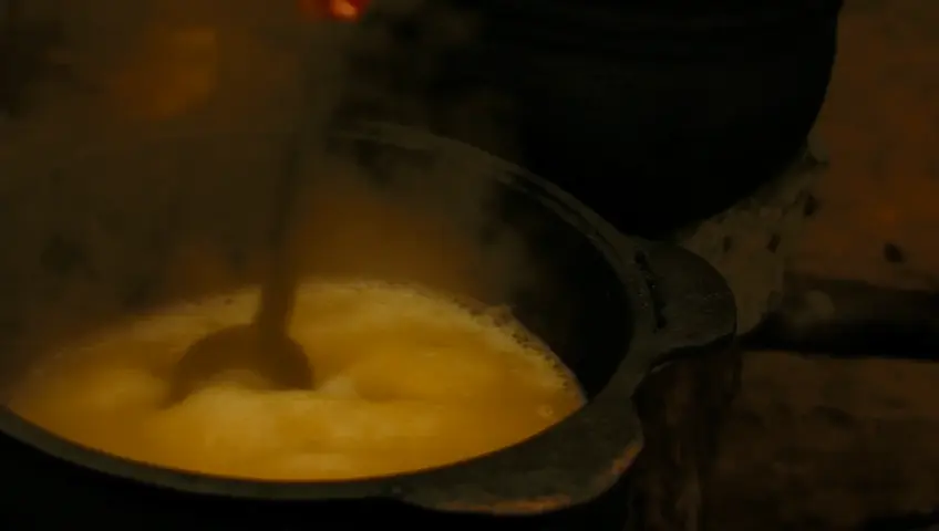 The rock in a tavern making a soup and tasting it