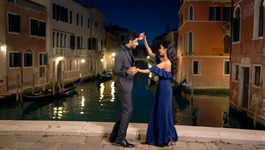 A handsome Pakistani man and a young, cute Pakistani woman are elegantly dancing on a stone-paved Venetian bridge at night. Below them, gondolas drift slowly along the peaceful canal, their lights casting reflections on the calm water. The Pakistani man wears a tailored charcoal grey suit with a soft silver shirt, paired with sleek black leather loafers, his look sharp and sophisticated. The Pakistani woman stuns in a midnight blue off-shoulder dress, the fabric hugging her figure and flowing into a chiffon trail that sways with every move. Her silver heels complement her look, and her hair is styled in an elegant up do, with soft curls framing her face. The couple dances gracefully, their movements flowing with slow, romantic spins, delicate dips, and synchronized twirls. The atmosphere is serene, with the moonlight bathing the scene in a soft glow, while the gentle ripples in the canal mirror the calmness of the night. The entire moment feels timeless, as their graceful dance and the quiet beauty of the Venetian setting create a perfect, intimate ambiance.