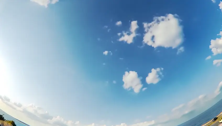 clouds in the shape of joined hands and different looking faces
