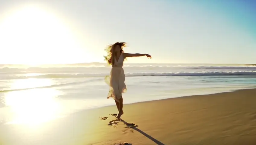 Beneath the golden embrace of the setting sun, she dances with the waves, a symphony of grace and freedom. Her bare feet kiss the shoreline, leaving fleeting imprints on the sand as the tide rushes to erase them. The ocean mirrors her soul—wild, untamed, and endlessly deep.

Each sway of her body mirrors the rhythm of the sea, her laughter mingling with the melody of crashing waves. She is a poem written by the wind, a masterpiece painted by the horizon, her hair flowing like silk strands of twilight.

In her dance, there’s no restraint—only a seamless connection between her spirit and nature's vast expanse. The waves, as if enchanted, rise to meet her, their sparkling crests twirling in harmony with her movements. She is not just a girl on the shore; she is the sea’s muse, a fleeting dream of beauty and freedom, forever etched into the heart of the ocean