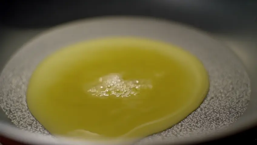 Butter melting, garlic sizzling, cream being poured, and cheese being whisked into a smooth sauce. Add a sprinkle of salt and pepper for seasoning.