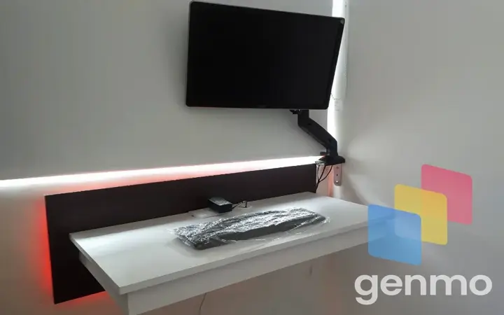 a flat screen tv mounted to the side of a wall