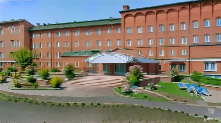 a red brick building with a green roof