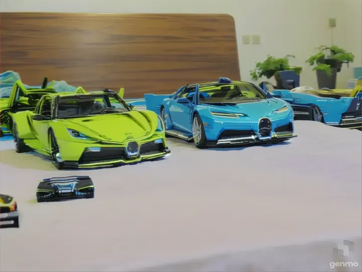 a couple of toy cars sitting on top of a bed