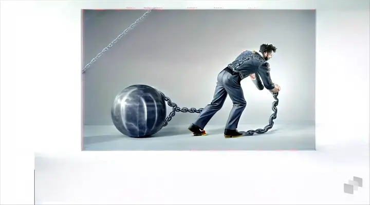 a man in a suit pushing a ball with chains