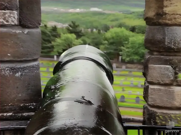 a close up of a cannon on a stone wall