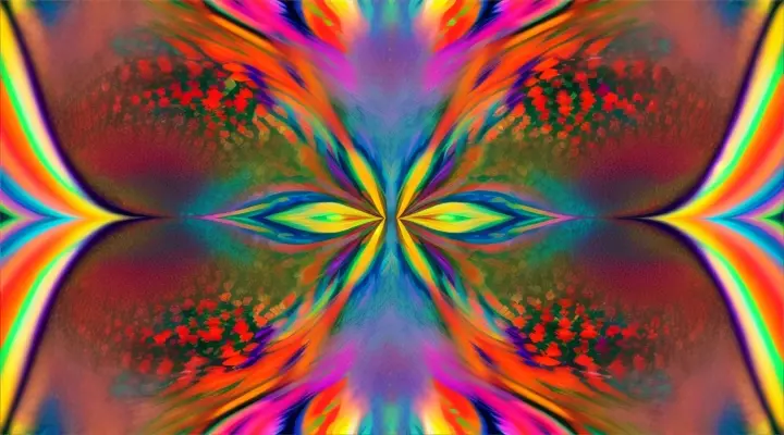 A vibrant psychedelic kaleidoscope of colorful flower blooms slowly morph as the camera slowly rotates 