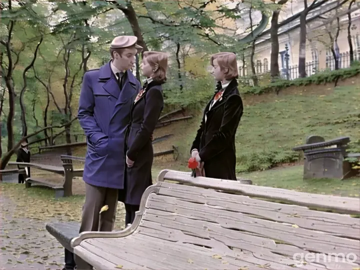 a man and a woman standing next to a wooden bench