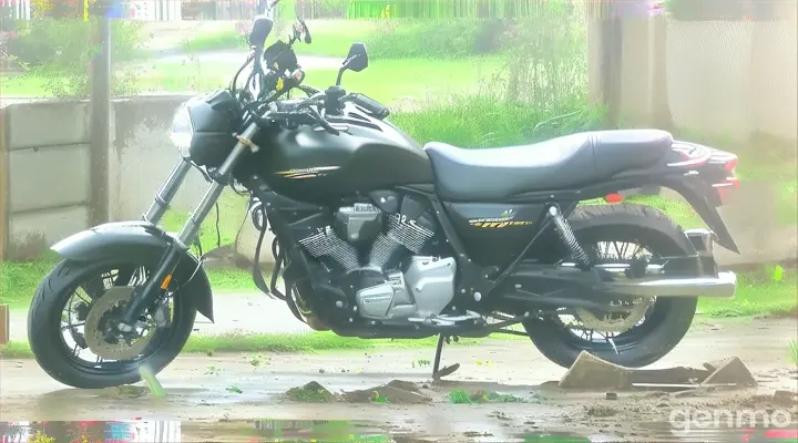 a black motorcycle parked on a dirt road