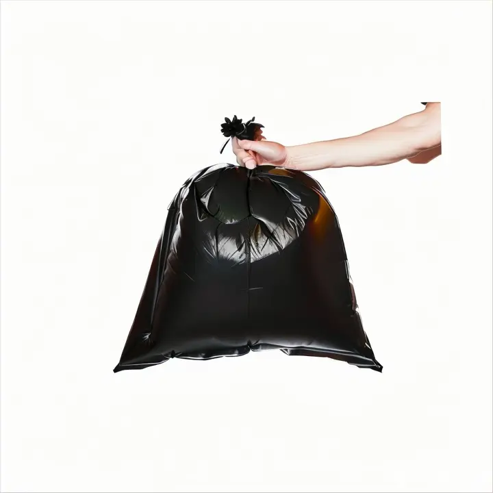 a hand holding a black bag with a flower on it