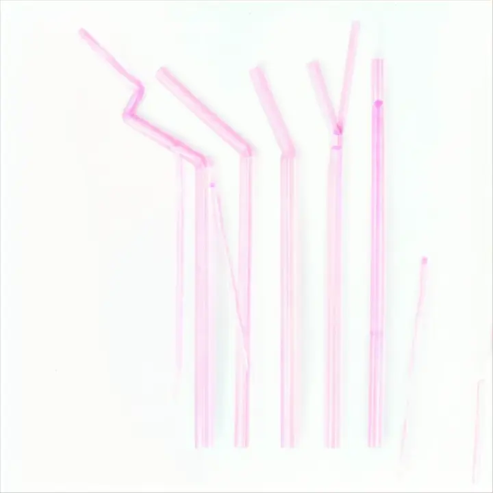 six pink straws are lined up in a row