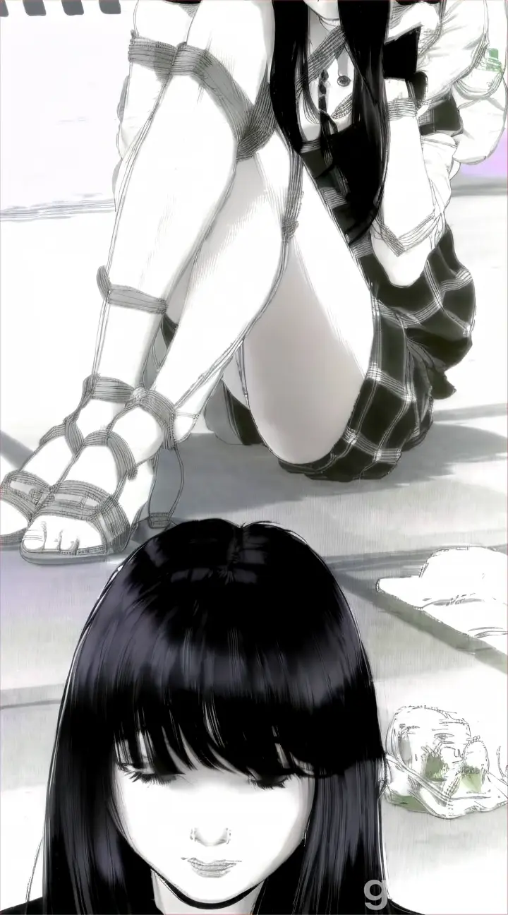 a girl with long black hair sitting on the ground