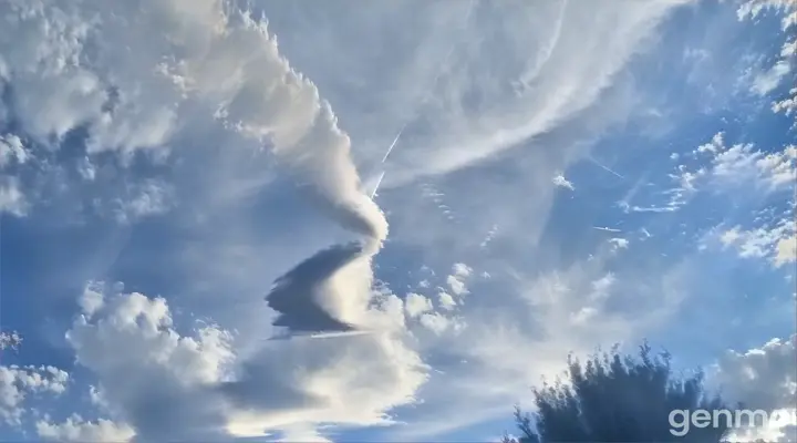 A paper yellow plane flying in the sky
