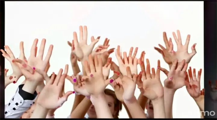 a group of people with their hands in the air