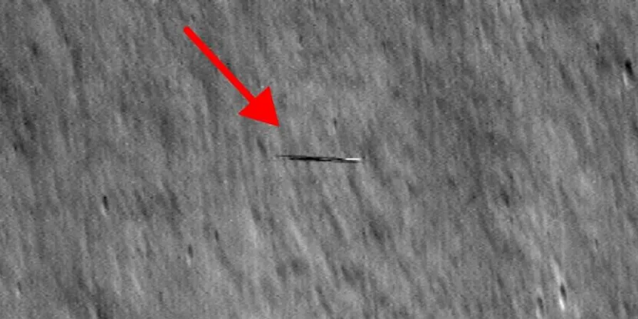 a red arrow pointing to the left on the surface of the moon