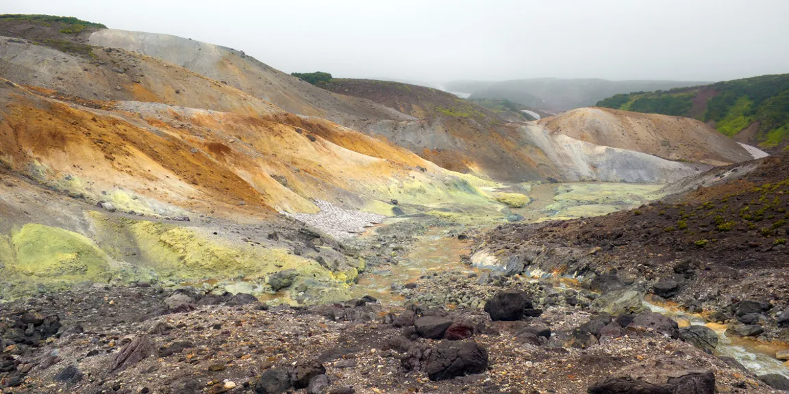 a group of hills that are covered in dirt