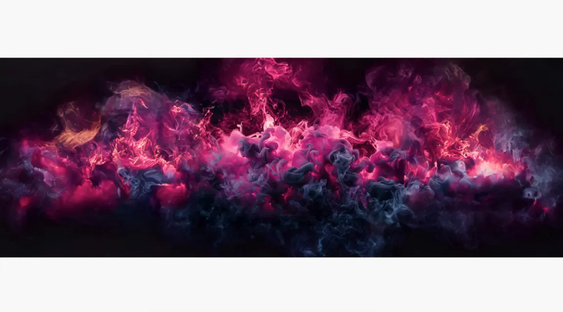 a black background with pink and blue smoke