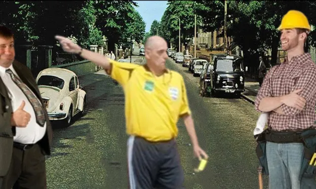 a man in a yellow shirt points at a car