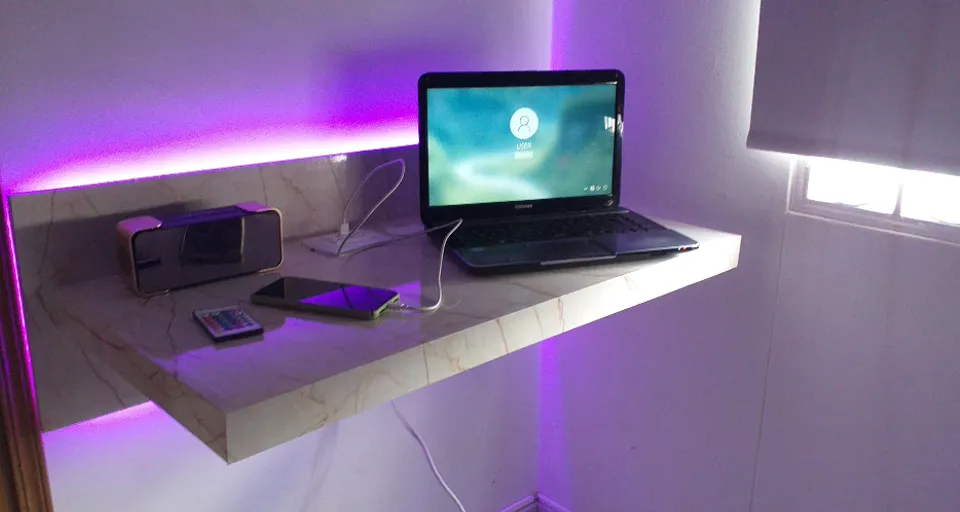 a laptop computer sitting on top of a desk