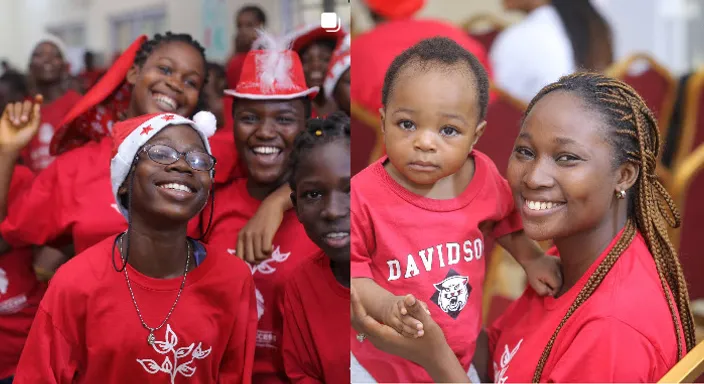 a group of women in red shirts posing for a picture