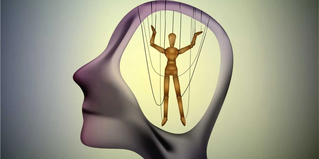 a person is suspended on strings in the shape of a human head