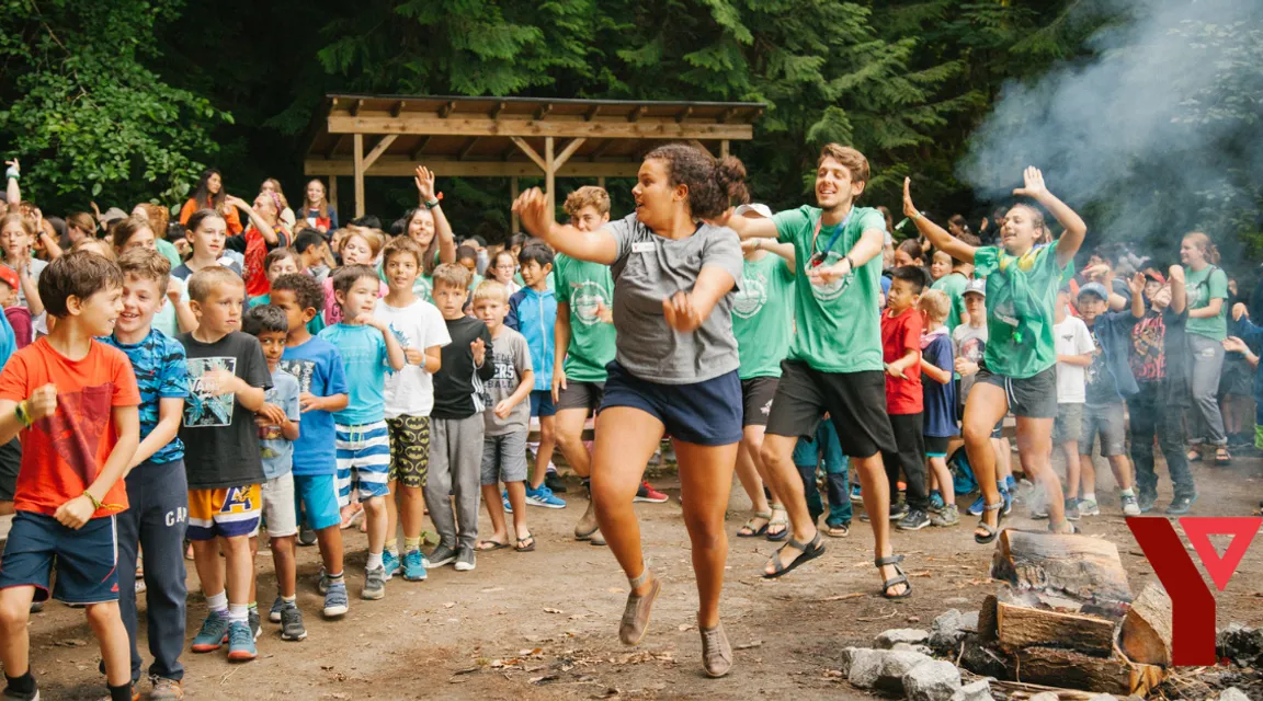 a group of people running in front of a crowd