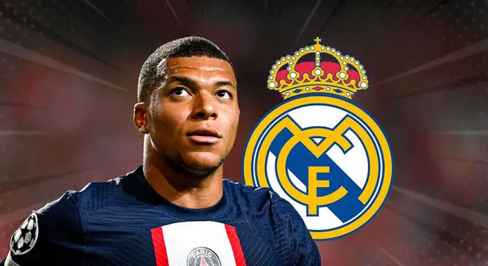 Mbappe looking at the real madrid club logo