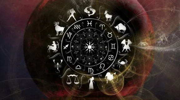 a picture of a clock with zodiac signs on it