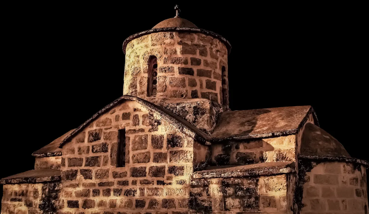 an old brick building with a steeple and a cross on top