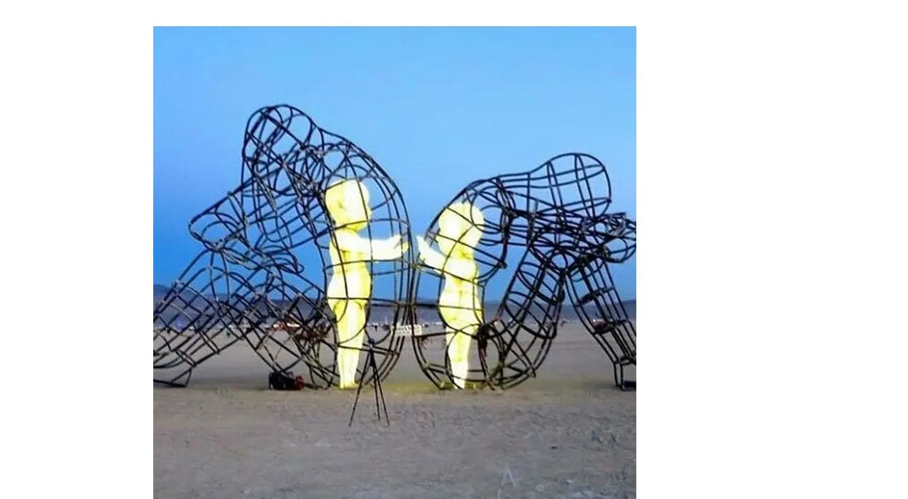 a couple of large sculptures sitting on top of a sandy beach. Inside each sculpture, there is an inner child trying to break free