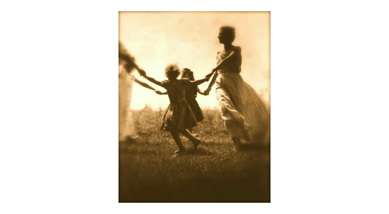 a sepia photograph of two children holding hands