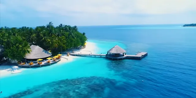 an aerial view of a resort on a tropical island