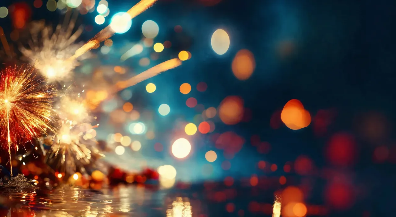 a colorful fireworks display with blurry lights in the background