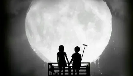 two people standing on a bench in front of a full moon