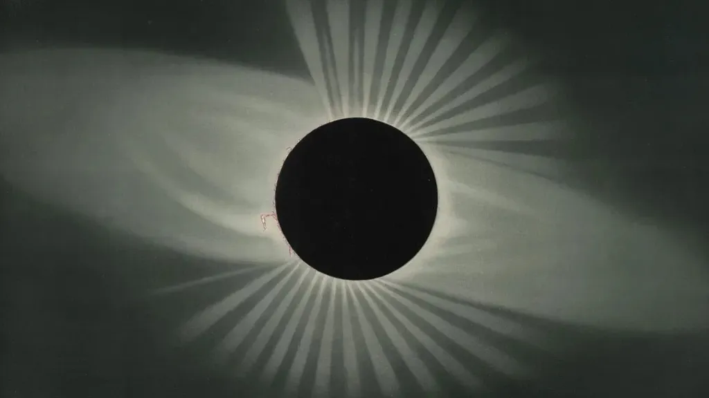 a black and white photo of a solar eclipse