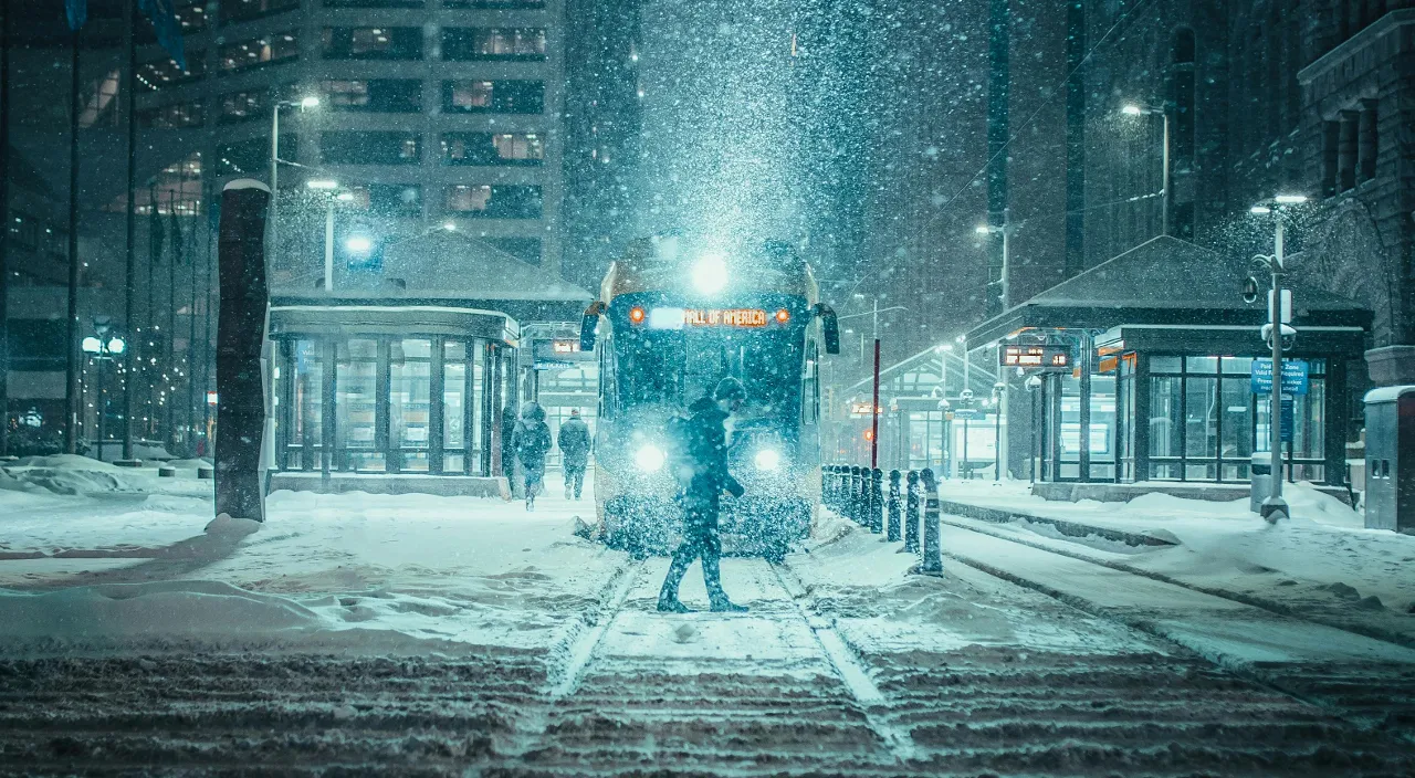 a train on a train track in the snow