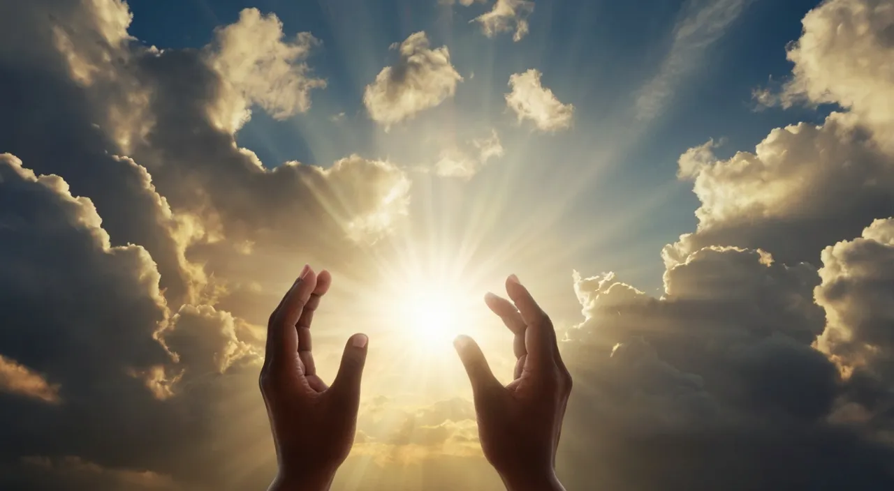 a pair of hands reaching up towards the sun