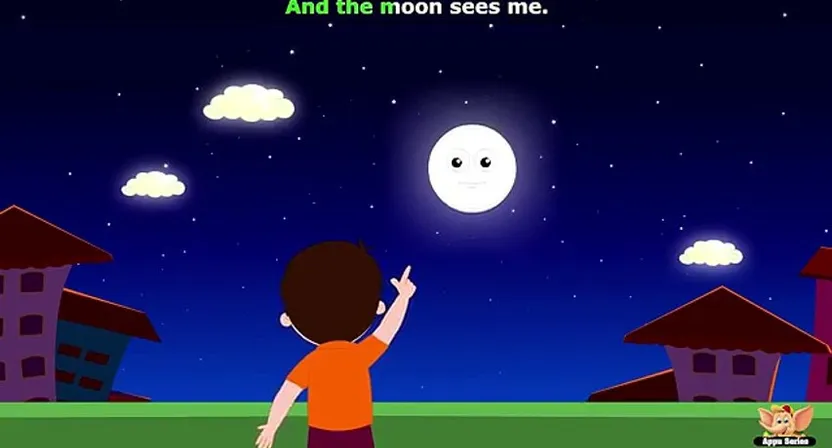 a young boy staring at a full moon