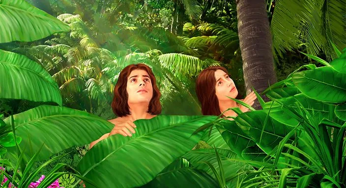 a couple of women standing in a lush green forest