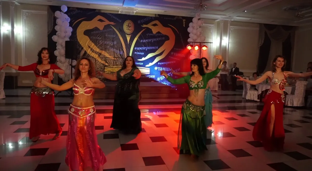 a group of women dancing on a dance floor