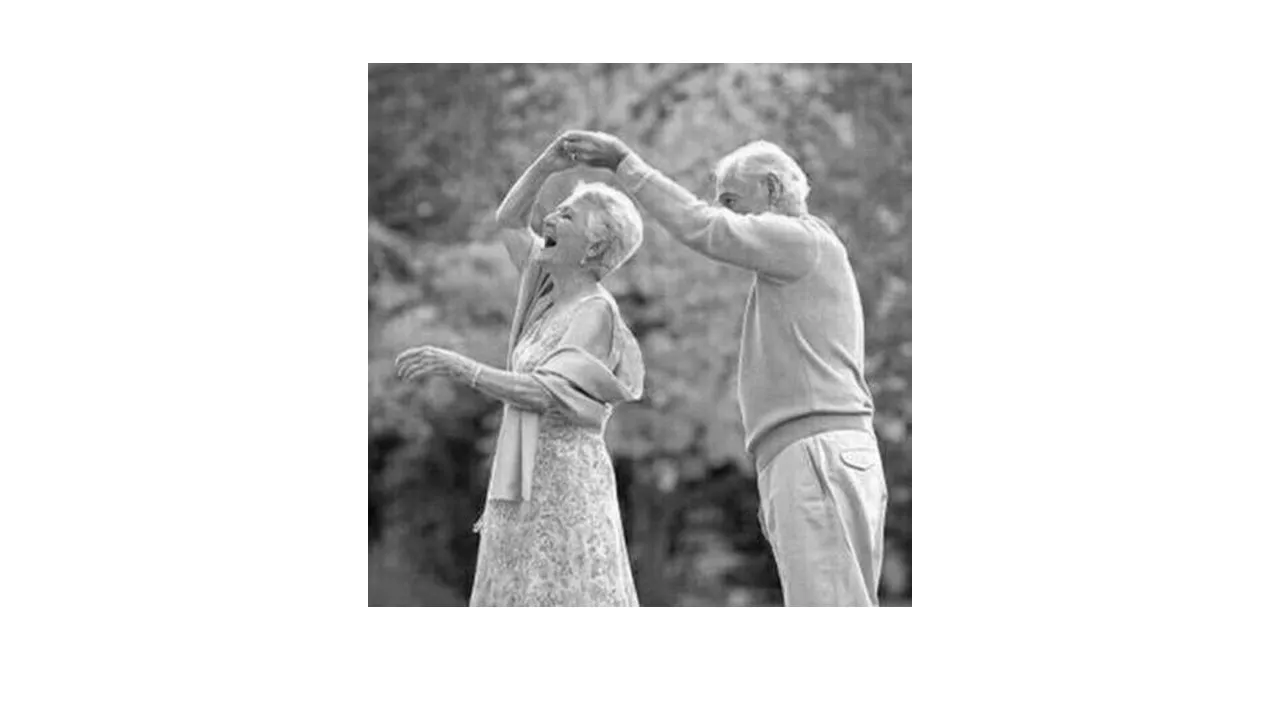 a black and white photo of two people standing next to each other