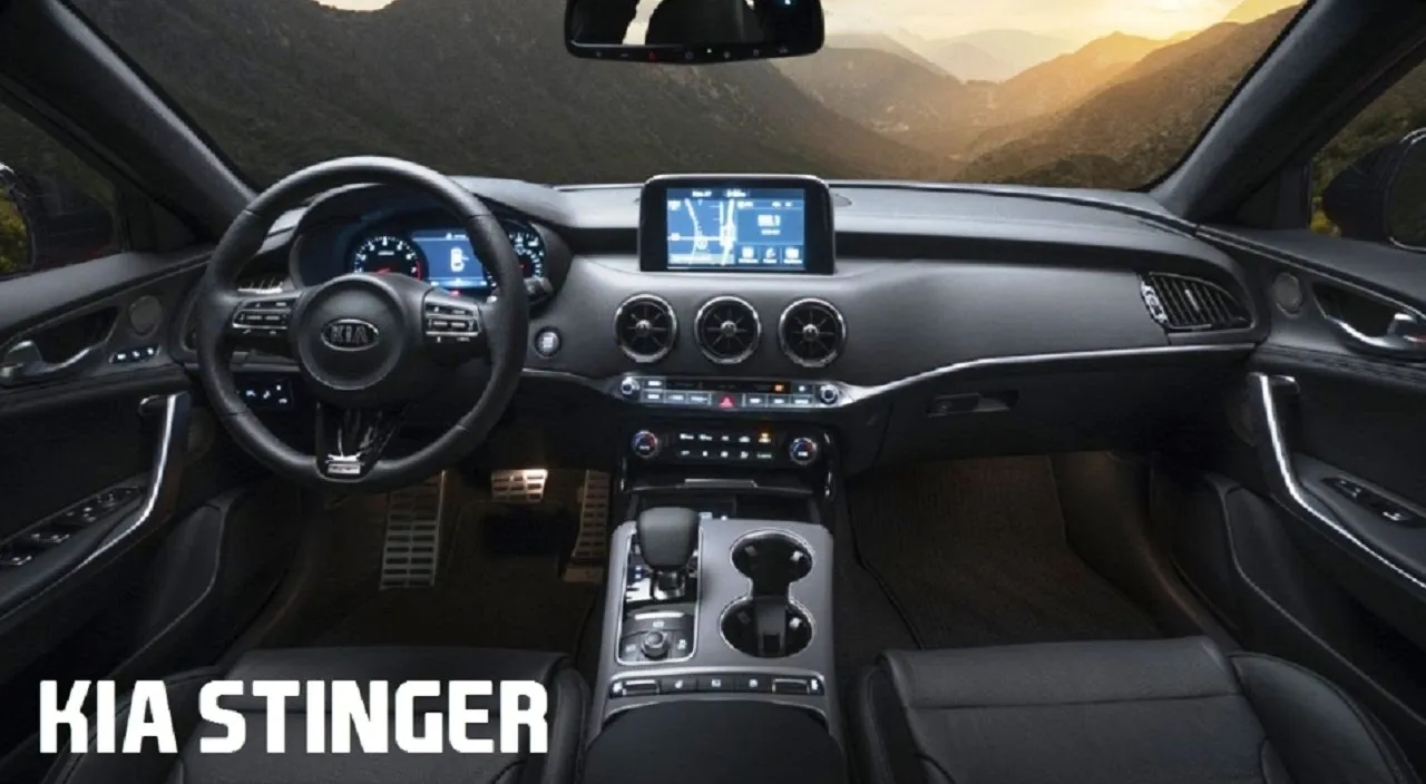 Inside the Kia Stinger cabin with views of the rocks and ocean, professional, cinematic