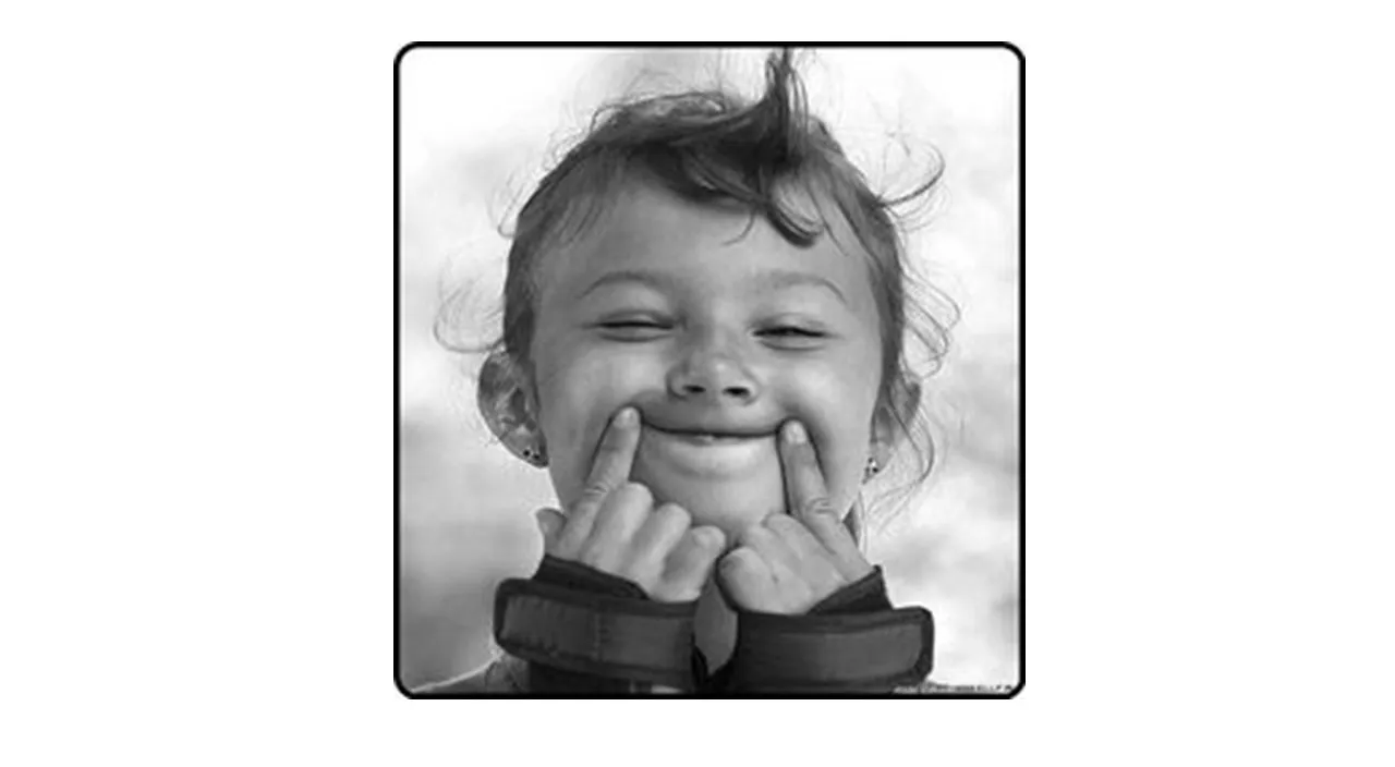 a black and white photo of a little girl