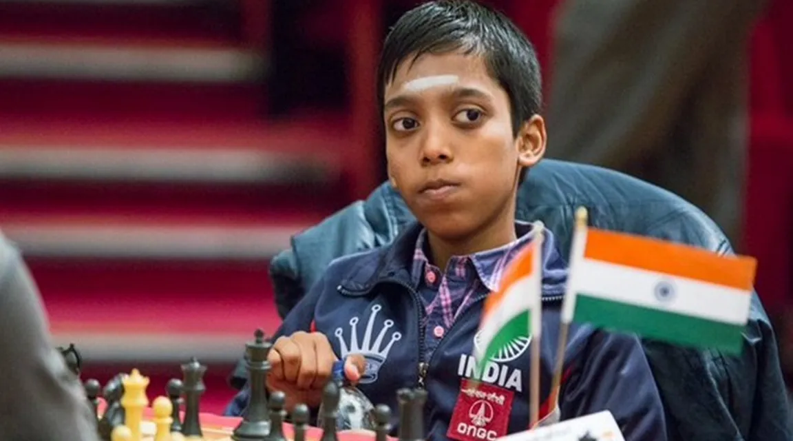 a young boy is playing chess in india